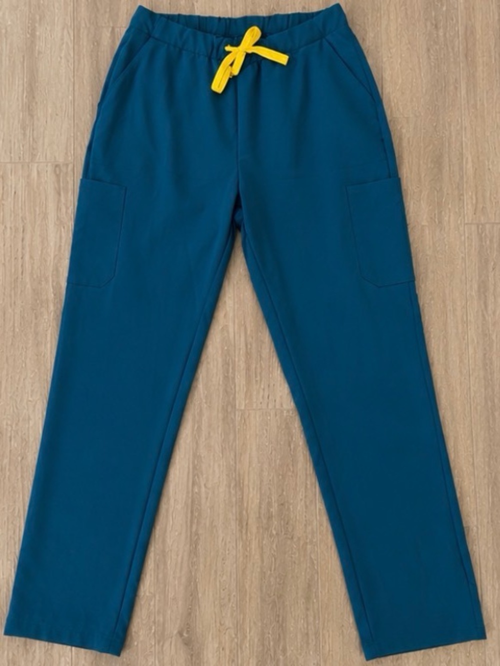 Teal scrubs with Yellow Tie